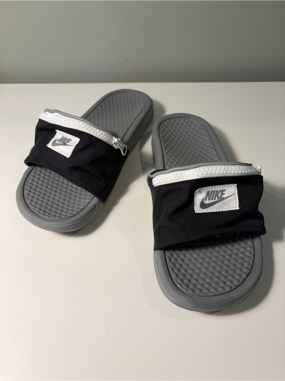 Nike Benassi JDI Fanny Pack slides in black and cool grey